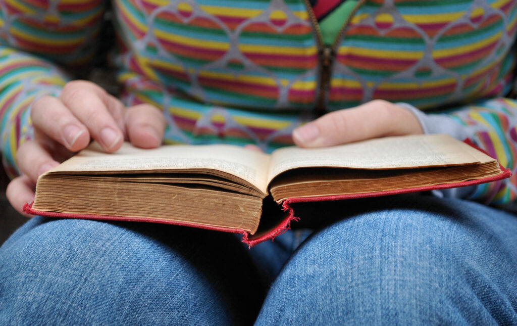 A book resting on a reader's lap