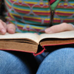 A book resting on a reader's lap
